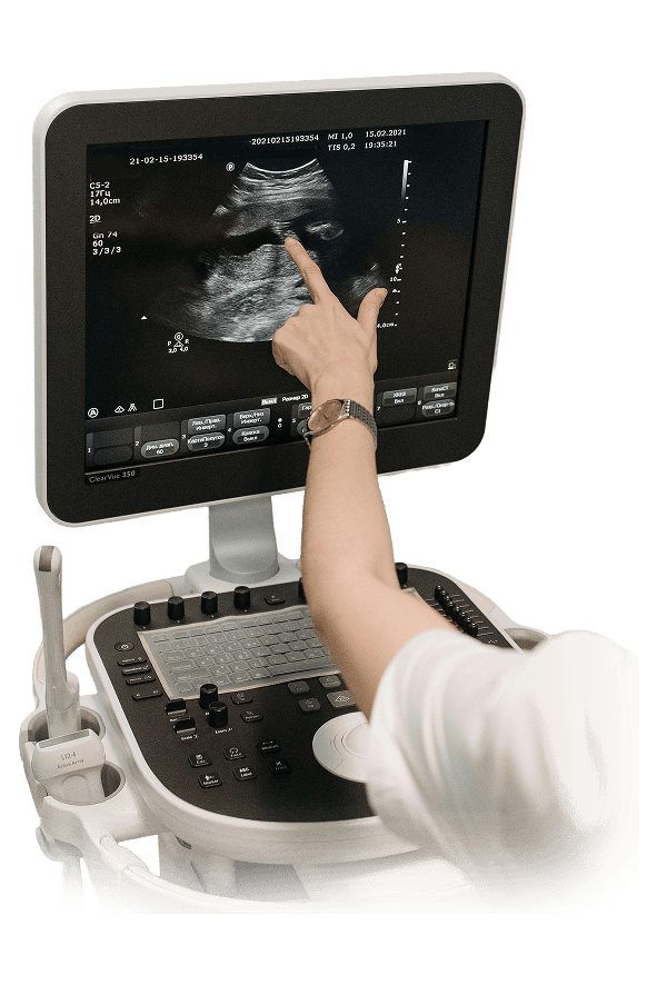 Sonographer operating an ultrasound machine